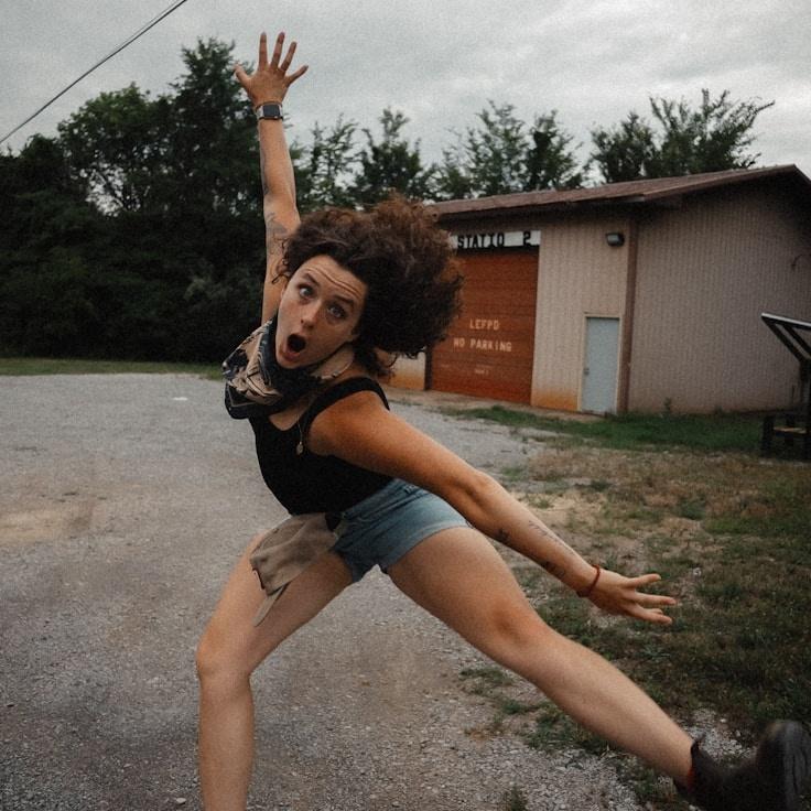 Kaveri Mehta, Lead Design Curator at Meadow Crest Studio, reviewing corporate floral arrangements